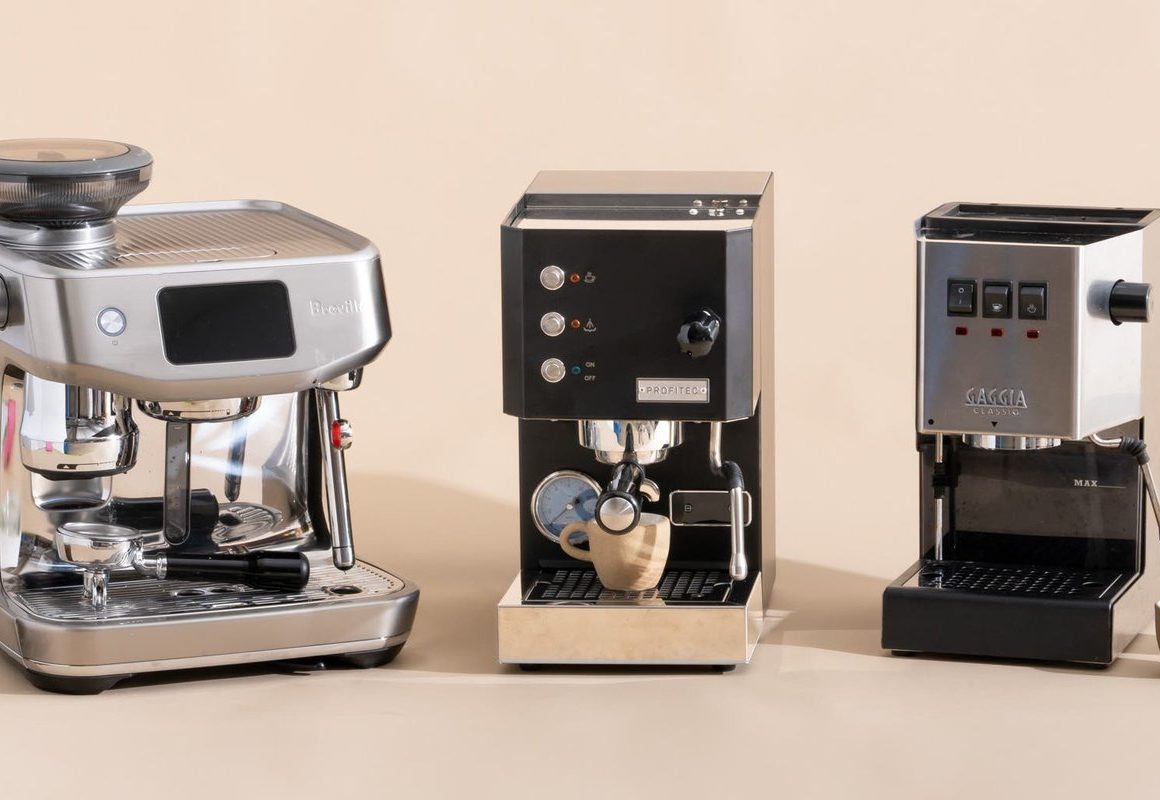A budget espresso coffee machine beside a fresh cup on a white countertop.
